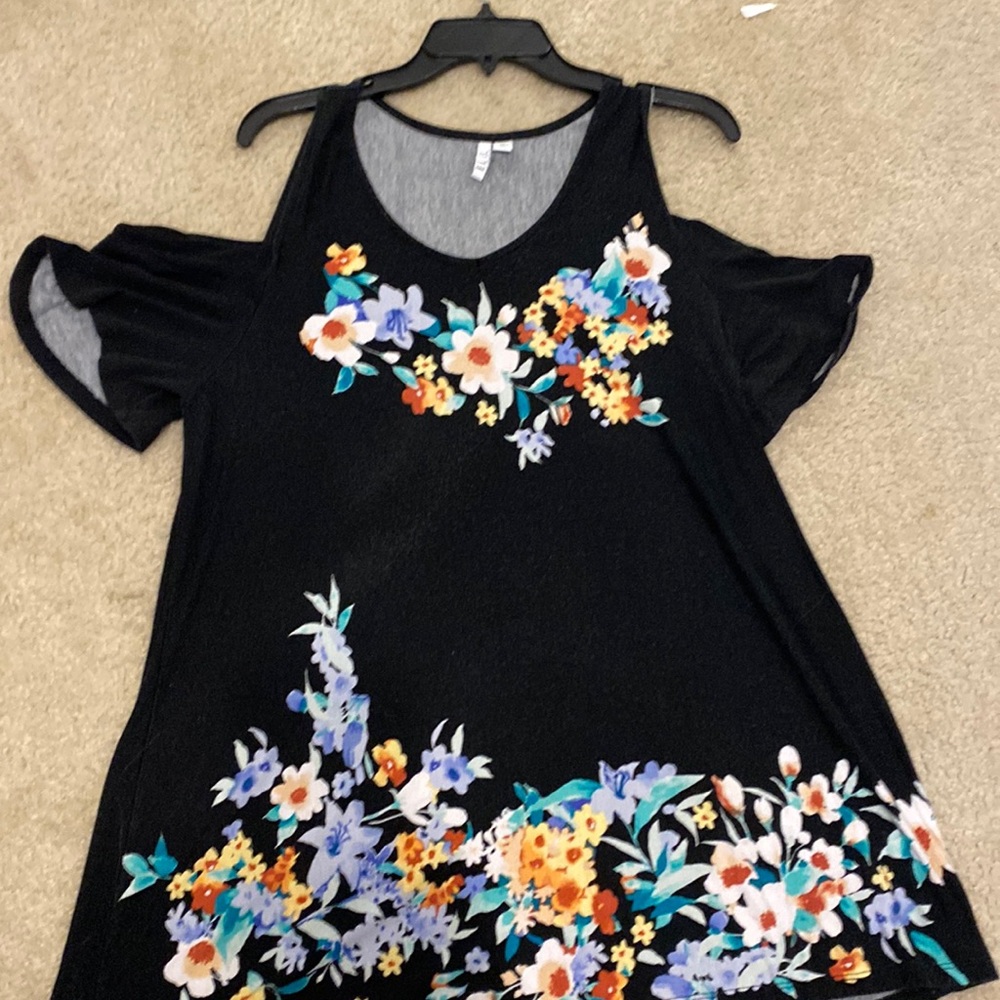 Elle shirt. On the longer side. Hangs off both shoulders